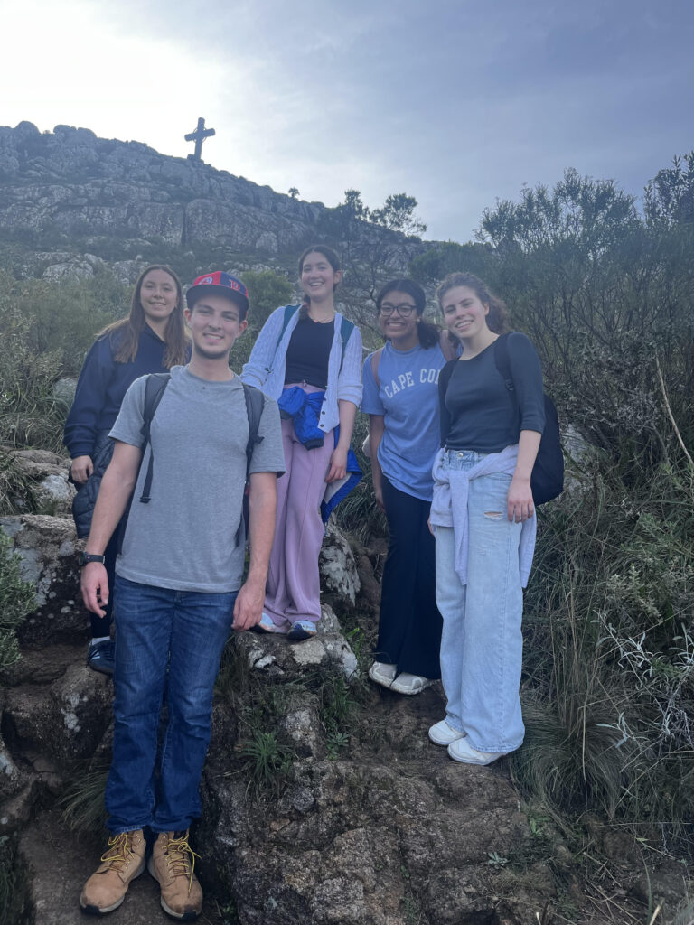 Carmela and friends at the top of a mountain.