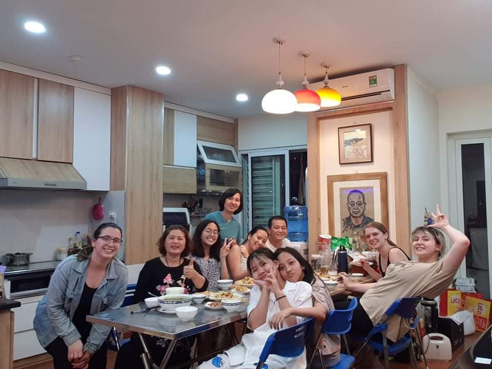 Image of student having a meal with her host family in Vietnam