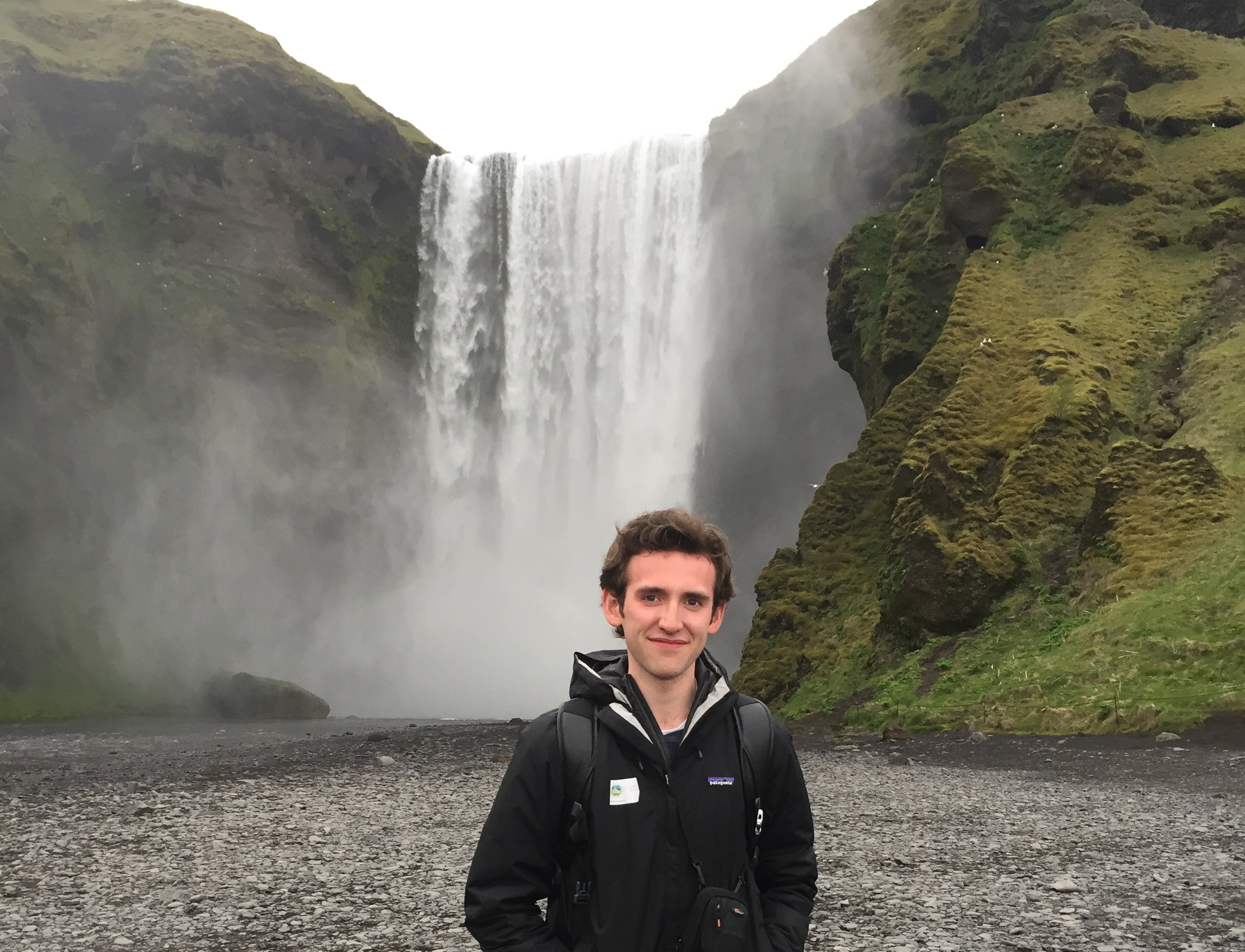  Joseph standing in front of Skógafoss Waterfall in Iceland