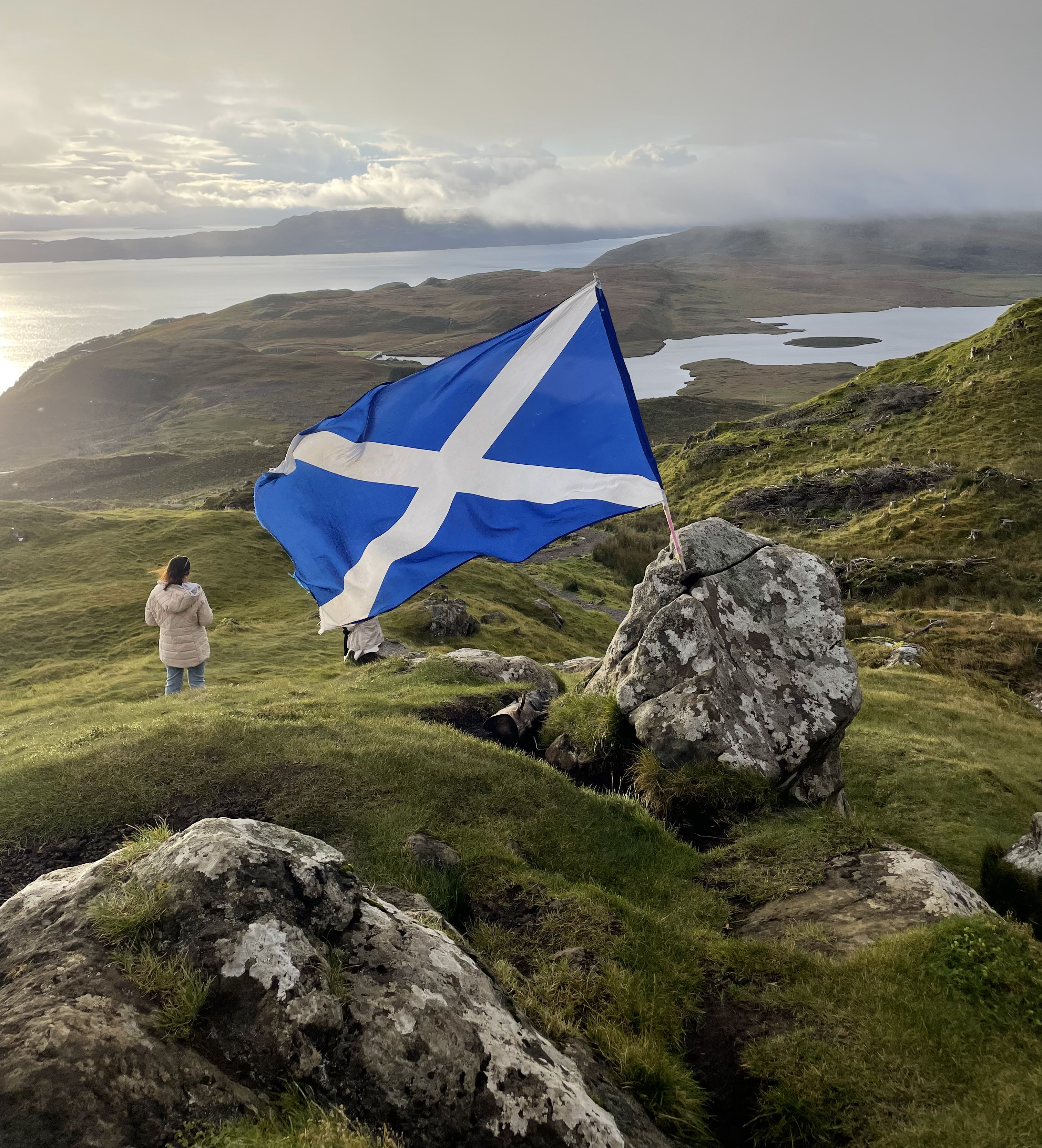 View of Scotland's flag from a mountain view.