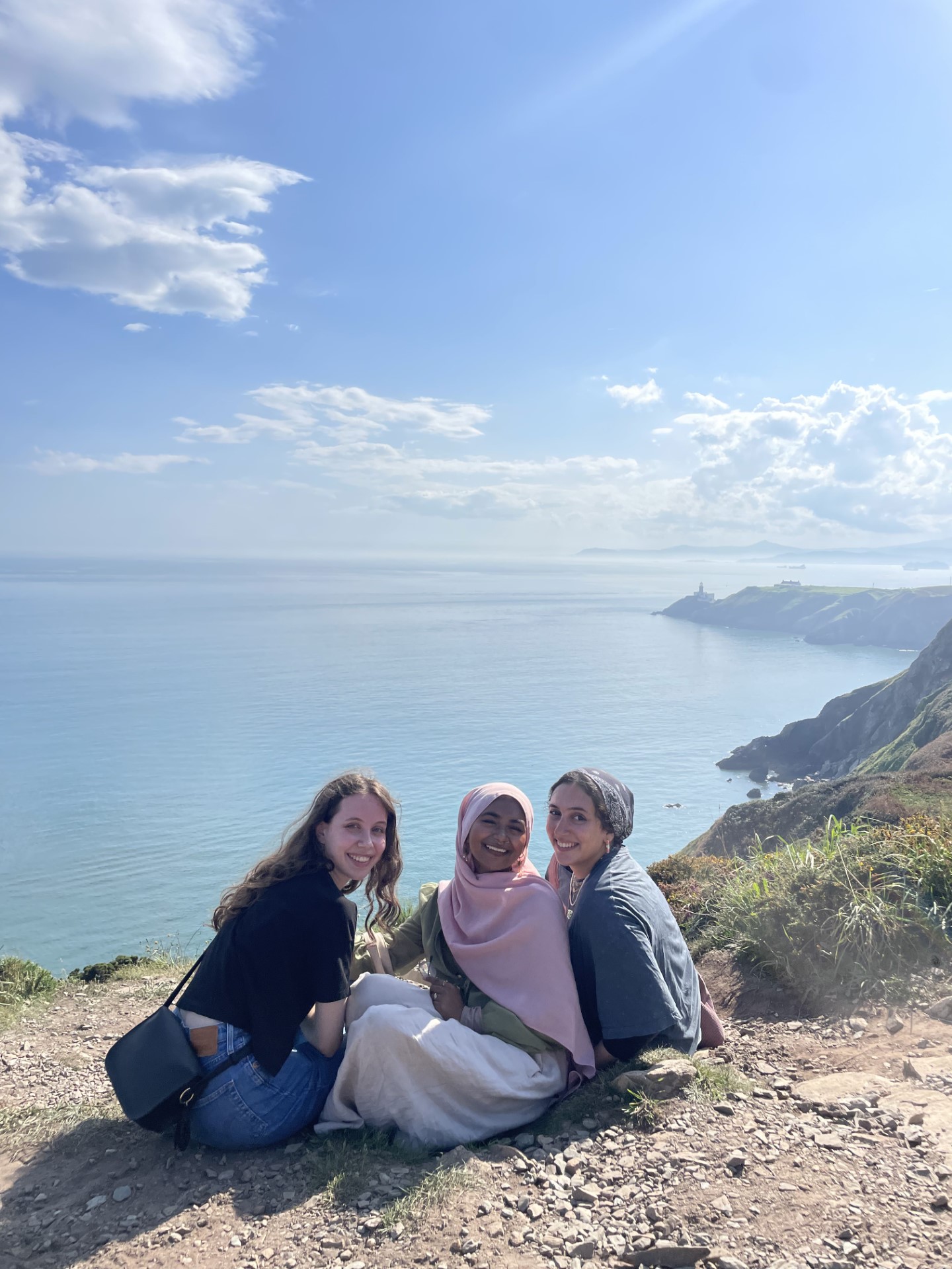 Sabirah (middle) hiking with two Erasmus students in Howth, Ireland alongside the Bog of Frogs Loop.