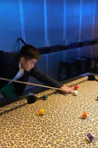 Student playing pool