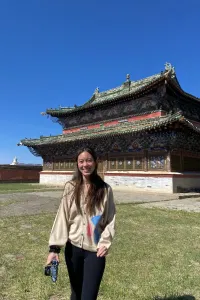 Student standing in front of Erdene Zuu Monastery in Kharakhorum