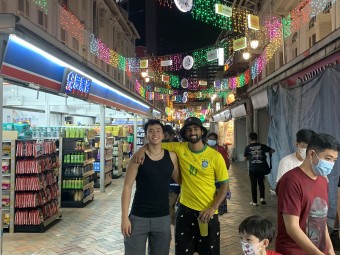 Alex shopping with a friend in Chinatown