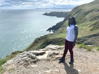 Josée standing by a scenic view in Ireland