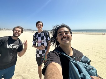 David with friends on a beach.