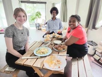 Sekia with other interns celebrating their work by sharing a homecooked meal at one of TOKI's two office locations.