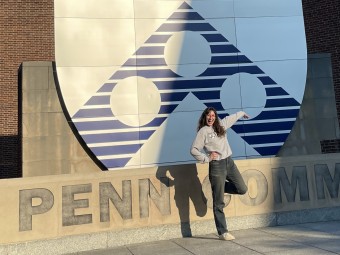 Emma with the Penn sign