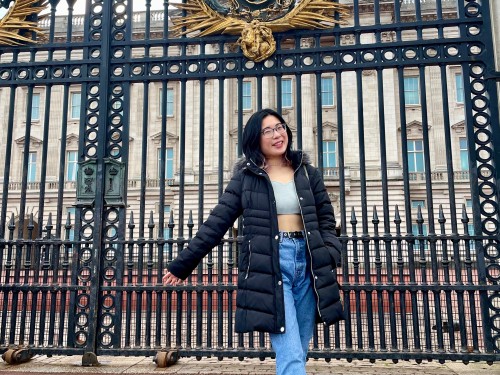 Student standing in front of Buckingham Palace