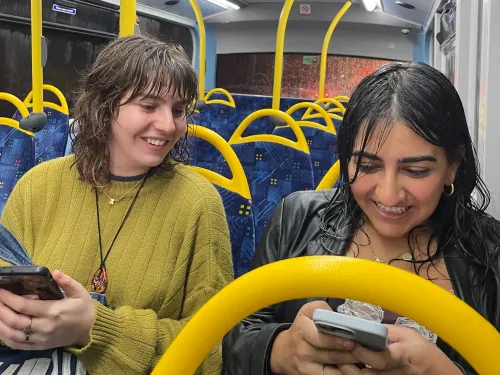 Students riding the bus in the rain