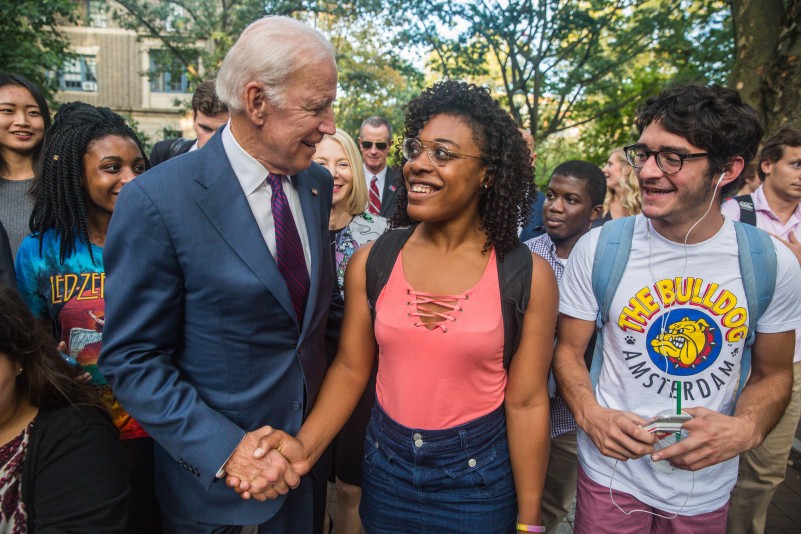 Joe Biden shakes hands with a Penn student