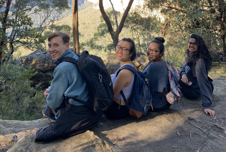 Students sitting on a rock in Australia