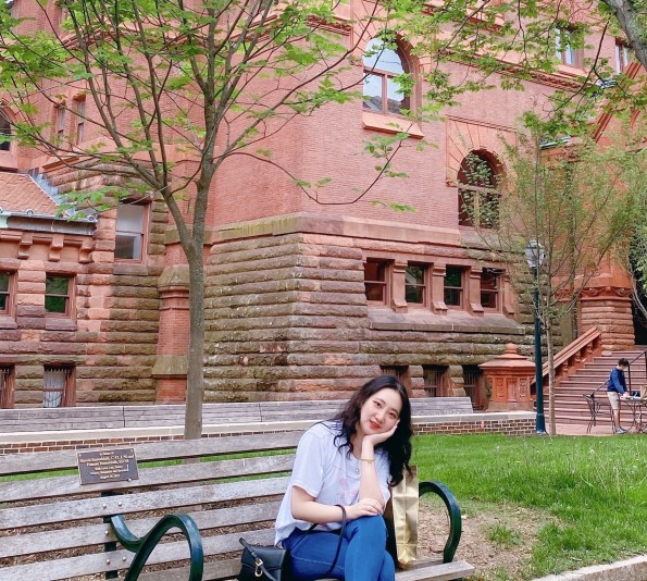 Linxuan Xie Vivian in front of Fisher Fine Arts Building