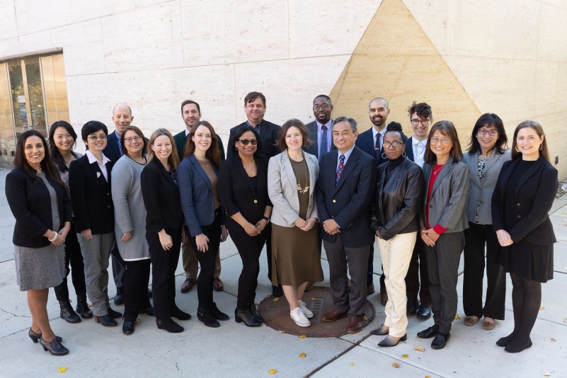 Group photo of International Student and Scholar Services team in front of Perry World House on Campus