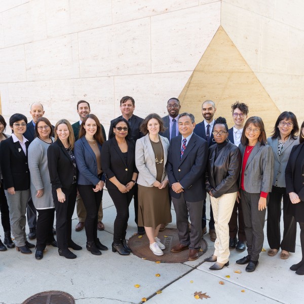 Professional group photo of the ISSS staff outside of Perry World House on the University of Pennsylvania Campus