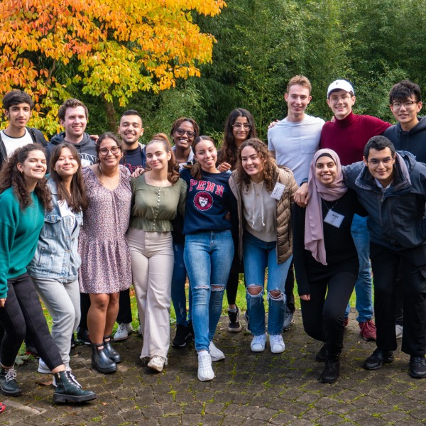 2021 Intercultural Leadership Participants pose for a photo in a forested setting