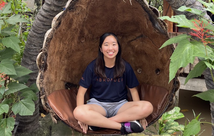 Student sitting in coconut themed chair