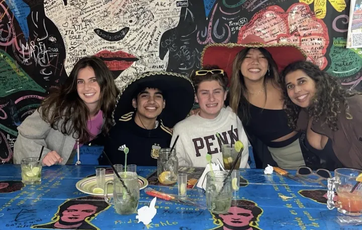 Student eating with others in Argentina