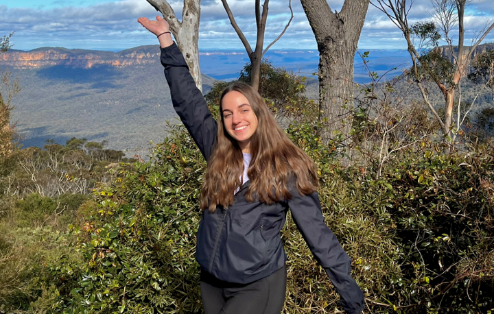 Student standing in front of nature in Australia