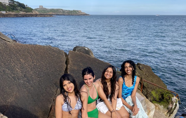 Ishaani Basu with friends by the sea