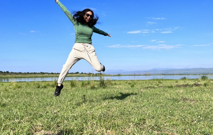 Jumping for joy in front of the Victoria Nile River