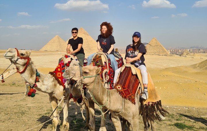 Filip and friends riding camels